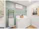 Laundry room with washer, dryer, storage rack and 