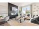 Cozy living room with fireplace and large window offering natural light at 988 Sutherland Lane # 33, Lawrenceville, GA 30043