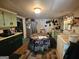 A view of the kitchen with cabinets and countertops and kitchen table at 4284 Highway 81 S, Covington, GA 30016