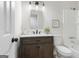 Updated bathroom with a dark wood vanity, modern lighting, and a tub-shower combo at 510 River Run Dr, Atlanta, GA 30350