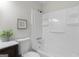 Bathroom featuring a tub with a shower and a vanity with a dark wood cabinet at 510 River Run Dr, Atlanta, GA 30350