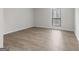 Bedroom features new wood flooring, base molding, and a large window at 510 River Run Dr, Atlanta, GA 30350