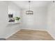 Bright dining room with hardwood floors and view of kitchen area at 510 River Run Dr, Atlanta, GA 30350