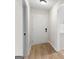 Bright hallway leading to the front door and kitchen featuring new floors and trim at 510 River Run Dr, Atlanta, GA 30350