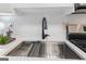Close-up of a modern kitchen sink and stainless steel appliances at 510 River Run Dr, Atlanta, GA 30350