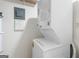 Cozy laundry room with a stacked washer and dryer unit and space-saving design at 510 River Run Dr, Atlanta, GA 30350