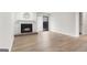 Cozy living room with a fireplace, hardwood floors, and sliding glass door to the outside at 510 River Run Dr, Atlanta, GA 30350