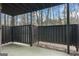 View of an outdoor patio area with a wooden fence and an adjacent building at 510 River Run Dr, Atlanta, GA 30350