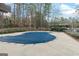 Exterior view of a condo complex with an outdoor pool covered with blue tarp at 510 River Run Dr, Atlanta, GA 30350