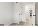 Bright room with view of kitchen featuring new floors, neutral paint and closet at 510 River Run Dr, Atlanta, GA 30350