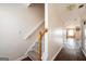 Image of the hallway with hardwood floors and a staircase with neutral carpet at 6517 Snowbird Ln, Douglasville, GA 30134