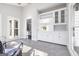 Bright sunroom with white cabinets, large windows, and tiled floor at 809 Byrnwyck Ne Rd, Brookhaven, GA 30319