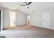 Spacious bedroom with carpet and ensuite bathroom access at 1015 Chapman Ln, Stone Mountain, GA 30088
