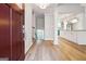 Inviting entryway leading to an open-concept living space with kitchen view and staircase at 1015 Chapman Ln, Stone Mountain, GA 30088