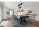 Entertainment space with a pool table, stylish lighting, and modern decor at 1015 Chapman Ln, Stone Mountain, GA 30088