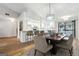 Beautiful kitchen with white cabinets, modern appliances, and breakfast bar adjacent to the dining area at 1015 Chapman Ln, Stone Mountain, GA 30088