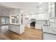 Modern kitchen features white cabinetry, granite counters, and stainless steel appliances at 1015 Chapman Ln, Stone Mountain, GA 30088