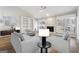 Inviting living room with vaulted ceiling, stone fireplace, built-in shelving, and ample natural light at 1015 Chapman Ln, Stone Mountain, GA 30088