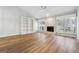 Spacious living room with fireplace, vaulted ceilings, hardwood floors, and built-in shelving at 1015 Chapman Ln, Stone Mountain, GA 30088