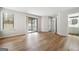 Bright and airy living room with laminate wood flooring and convenient access to a screened porch at 1015 Chapman Ln, Stone Mountain, GA 30088