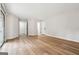 Spacious living room with laminate wood flooring and ample natural light at 1015 Chapman Ln, Stone Mountain, GA 30088