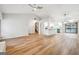 Bright and open living space showcases hardwood floors, kitchen, and stairway at 1015 Chapman Ln, Stone Mountain, GA 30088