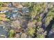 Aerial view of a home and property surrounded by lush greenery and mature trees at 916 Marshall Fuller Rd, Dallas, GA 30157