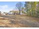 Expansive backyard featuring lush trees, a shed, and plenty of open space for outdoor activities at 916 Marshall Fuller Rd, Dallas, GA 30157