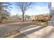Expansive backyard featuring a concrete patio, a deck, and a large grassy area at 916 Marshall Fuller Rd, Dallas, GA 30157