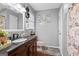 Updated bathroom with granite vanity, dark wood cabinets, and modern fixtures at 916 Marshall Fuller Rd, Dallas, GA 30157