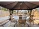 Outdoor deck with gazebo, hot tub, and patio furniture; ideal for relaxation and entertainment at 916 Marshall Fuller Rd, Dallas, GA 30157