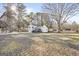 Exterior shot of home on lot, showcasing home, yard, shed and deck at 916 Marshall Fuller Rd, Dallas, GA 30157