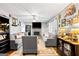 Bright living room boasts a stone fireplace, hardwood floors, and comfortable seating arrangement at 916 Marshall Fuller Rd, Dallas, GA 30157
