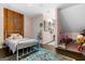 Pink bedroom featuring playful decor, a cozy bed, and a charming play area for imaginative adventures at 9209 W Banks Mill Rd, Winston, GA 30187