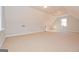 Spacious and carpeted bonus room with vaulted ceilings and natural light at 9209 W Banks Mill Rd, Winston, GA 30187