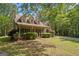 Inviting home with a covered porch, offering a perfect spot for relaxation and enjoying the outdoors at 9209 W Banks Mill Rd, Winston, GA 30187