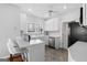 Clean kitchen featuring a breakfast bar, stainless steel appliances, and neutral paint at 9209 W Banks Mill Rd, Winston, GA 30187