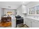 Bright kitchen featuring stainless steel oven and view to dining area at 9209 W Banks Mill Rd, Winston, GA 30187