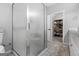 Large shower with glass doors, tile flooring and a walk in closet provides ample storage at 9209 W Banks Mill Rd, Winston, GA 30187