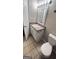 Bright bathroom featuring a single sink vanity, granite countertop, and a white framed mirror at 9091 Woodgreen Way, Jonesboro, GA 30238