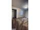 Cozy bedroom featuring neutral carpet, paint, and a closet at 9091 Woodgreen Way, Jonesboro, GA 30238