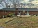Spacious backyard with patio, landscaping, and mature trees, perfect for entertaining and relaxation at 365 Jordan Dr, Tucker, GA 30084