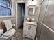 A bright bathroom is equipped with a single sink vanity and a tiled shower, offering a clean design at 365 Jordan Dr, Tucker, GA 30084