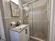 Bathroom featuring a functional vanity next to a glass-enclosed shower with modern fixtures at 365 Jordan Dr, Tucker, GA 30084