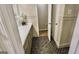 Bathroom features black and white patterned flooring, a view to the vanity, and an open doorway at 365 Jordan Dr, Tucker, GA 30084