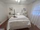 Comfortable bedroom featuring a ceiling fan, wooden floors, and an inviting queen-sized bed at 365 Jordan Dr, Tucker, GA 30084