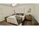 Cozy bedroom featuring a comfortable bed, ceiling fan and bedside tables with lamps at 365 Jordan Dr, Tucker, GA 30084
