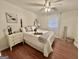 Inviting bedroom showcasing wood floors, a ceiling fan, and a well-appointed bed with stylish accents at 365 Jordan Dr, Tucker, GA 30084