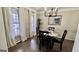 Dining room features elegant wainscoting, a round table with dark chairs at 365 Jordan Dr, Tucker, GA 30084
