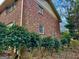 Brick house exterior features mature landscaping that offers privacy and curb appeal at 365 Jordan Dr, Tucker, GA 30084